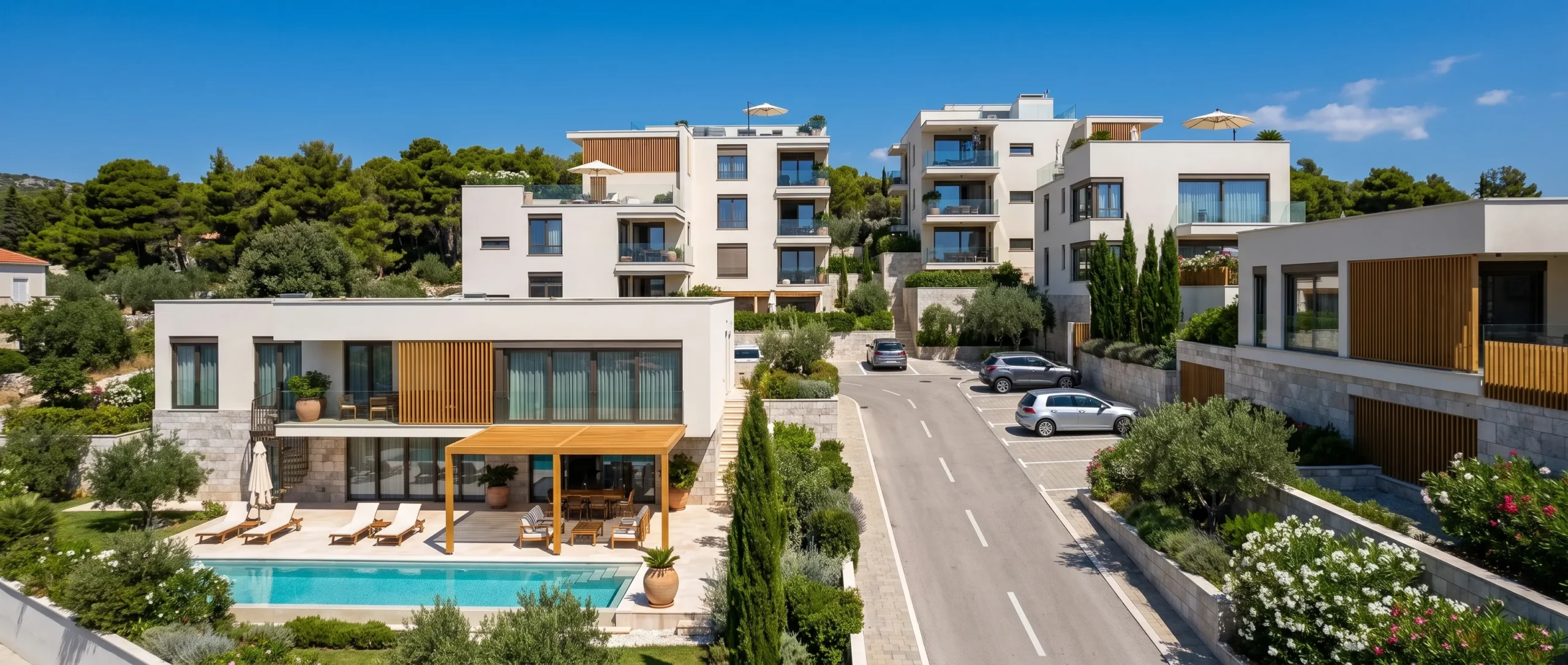 Internal road at Mirna Luka, a villa pool in front of the apartment buildings